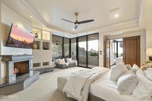 carpeted bedroom featuring access to outside and ceiling fan