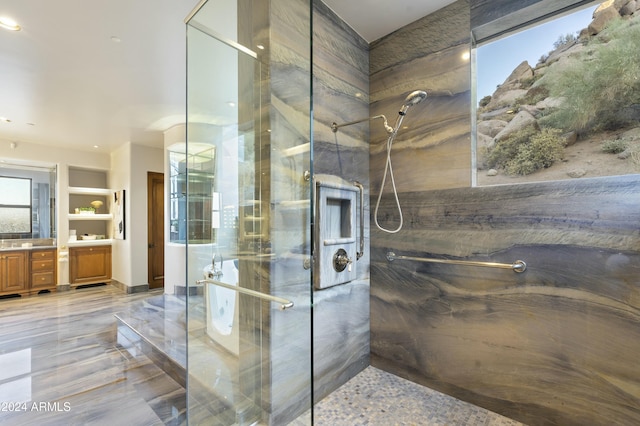 bathroom with vanity and a shower with shower door