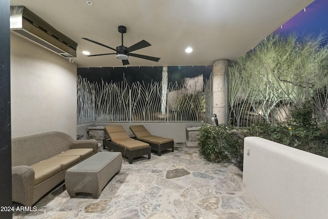 patio terrace at dusk with a wall unit AC and ceiling fan