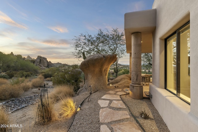 view of patio terrace at dusk