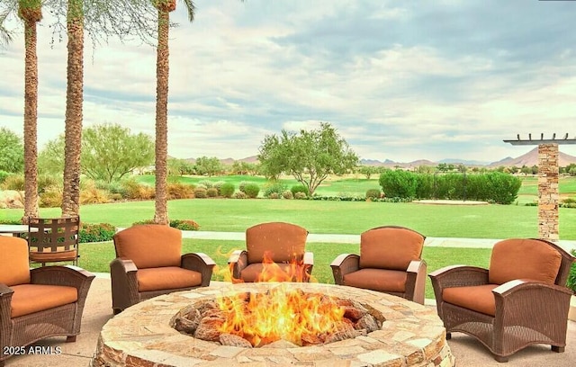 view of patio / terrace with a fire pit