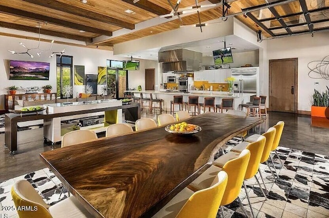 dining room featuring beamed ceiling