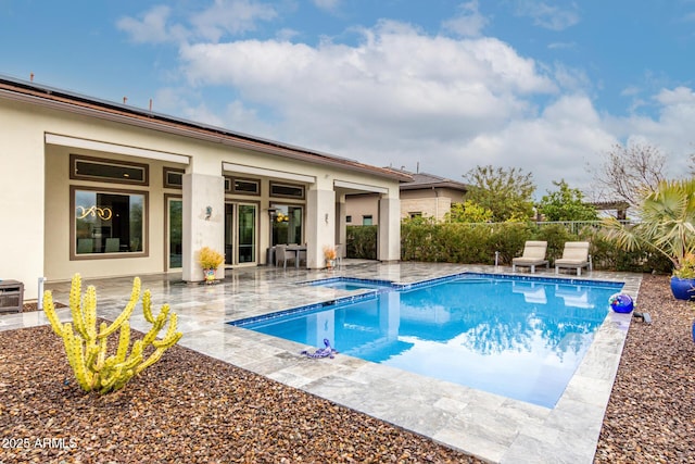 view of swimming pool with a fenced in pool, a patio, and fence