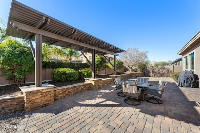 view of patio / terrace with outdoor dining area, a fenced backyard, grilling area, and a pergola