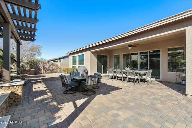 view of patio / terrace featuring outdoor dining space, a pergola, ceiling fan, and fence