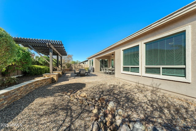 view of yard featuring a patio area, fence, and a pergola