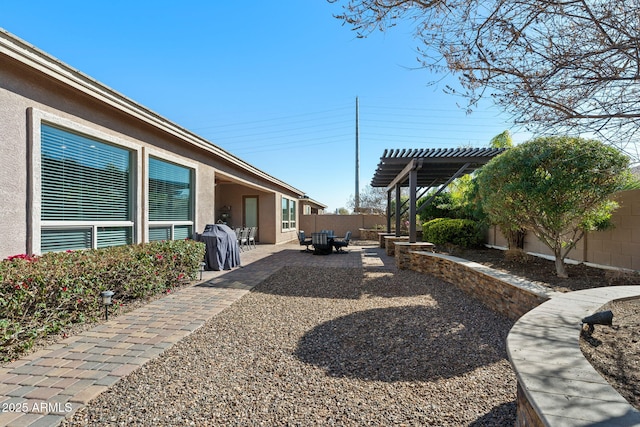 view of yard with a patio area, a fenced backyard, and a pergola