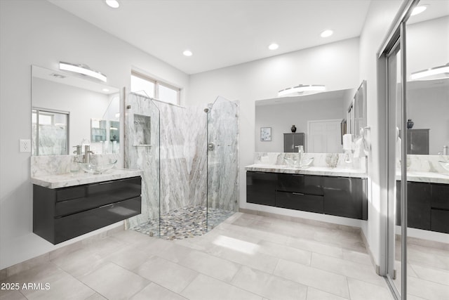 bathroom with vanity and an enclosed shower