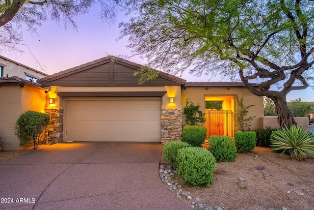 view of front of property with a garage