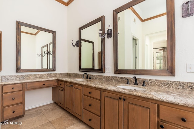 bathroom with ornamental molding and vanity