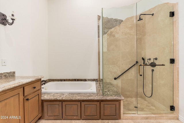 bathroom with shower with separate bathtub and vanity