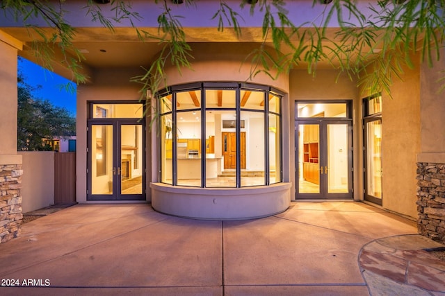 doorway to property with french doors and a patio area