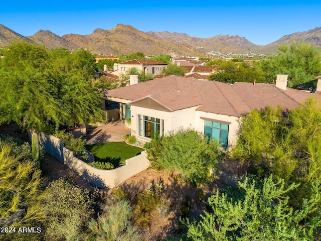 birds eye view of property with a mountain view