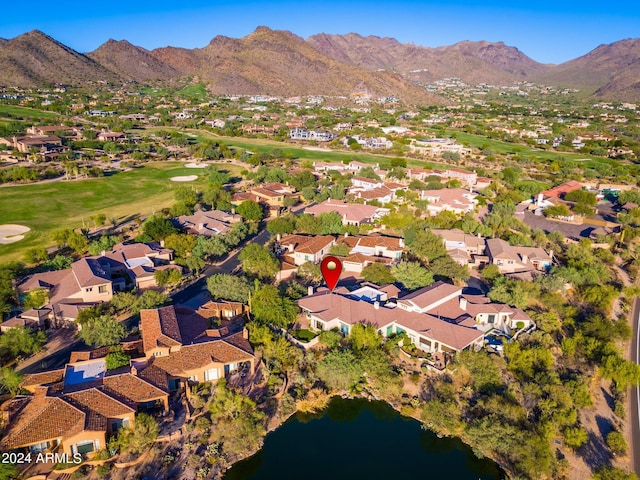 drone / aerial view with a water and mountain view