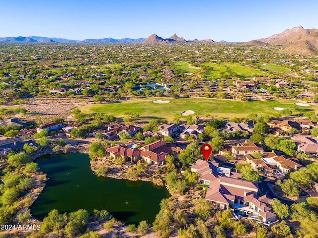 drone / aerial view featuring a water and mountain view