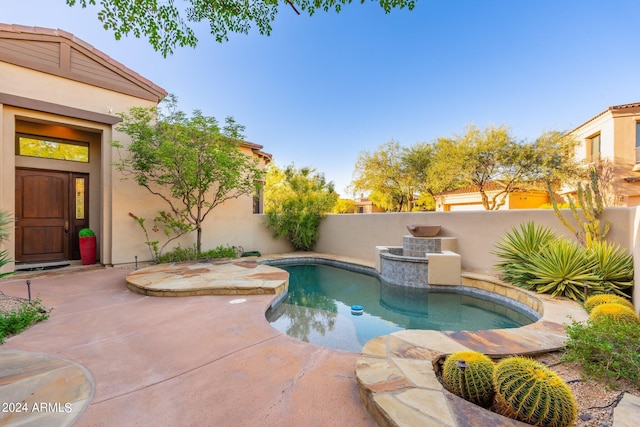 view of swimming pool featuring a patio