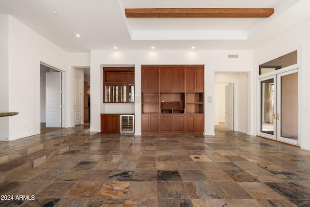 unfurnished living room with wine cooler