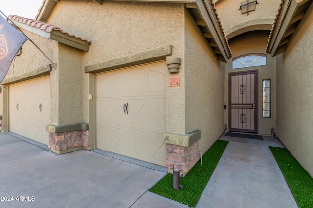 entrance to property featuring a garage