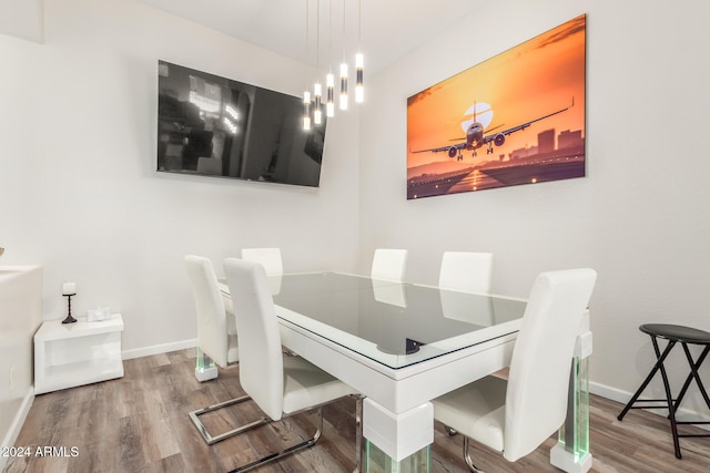 dining area with wood-type flooring