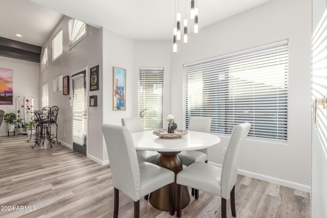 dining space with light hardwood / wood-style floors