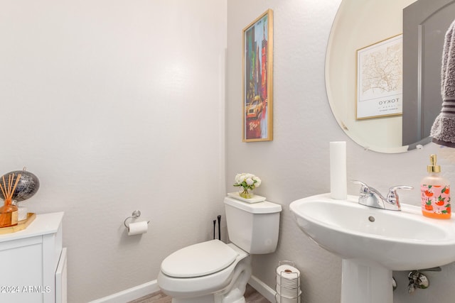 bathroom with toilet and sink