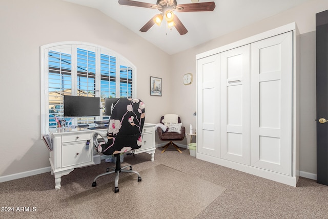 office featuring vaulted ceiling, carpet flooring, and ceiling fan