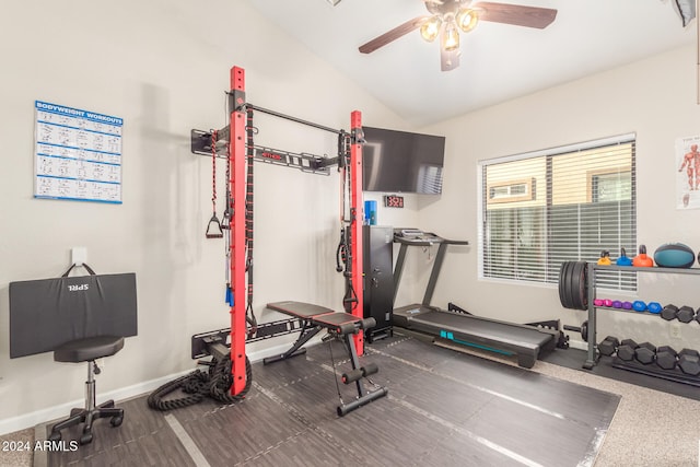 workout room featuring ceiling fan and vaulted ceiling