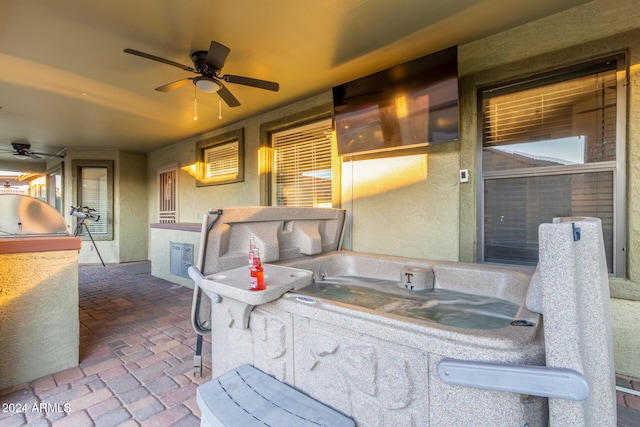 view of patio with a jacuzzi and ceiling fan