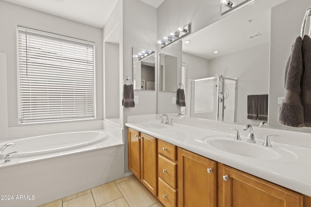 bathroom with vanity, plus walk in shower, and tile patterned floors