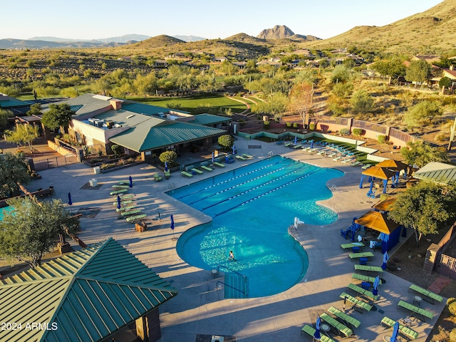 view of pool featuring a patio area and a mountain view