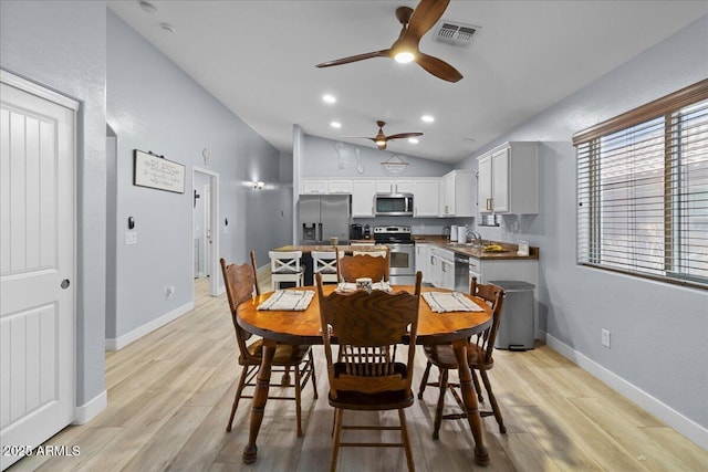 5026 S 235th Dr, Buckeye, AZ 85326 - dining area featuring a ceiling fan, light wood-style floors, and lofted ceiling