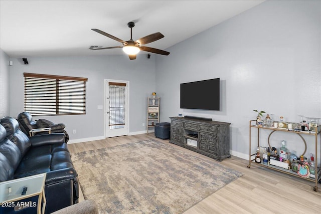 5026 S 235th Dr, Buckeye, AZ 85326 - living room with vaulted ceiling, ceiling fan, and wood finished floors