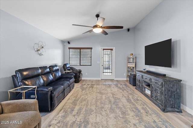 5026 S 235th Dr, Buckeye, AZ 85326 - living area with lofted ceiling, light wood-style floors, and a ceiling fan