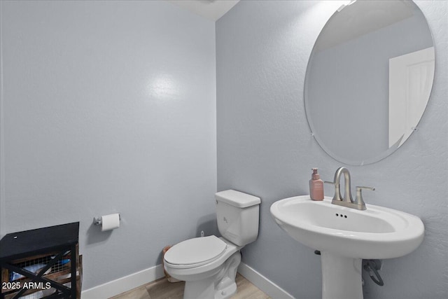 5026 S 235th Dr, Buckeye, AZ 85326 - bathroom with wood finished floors and toilet