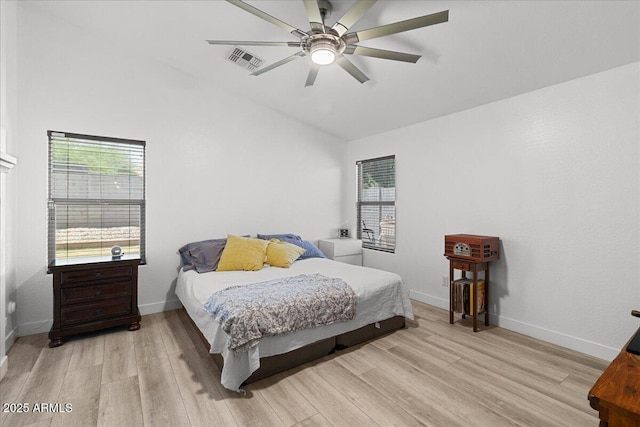 5026 S 235th Dr, Buckeye, AZ 85326 - bedroom featuring lofted ceiling, light wood-style flooring, and a ceiling fan