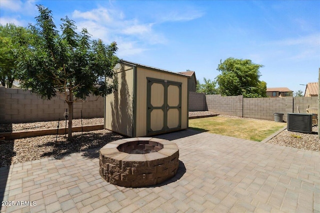 5026 S 235th Dr, Buckeye, AZ 85326 - view of shed with a fenced backyard and an outdoor fire pit