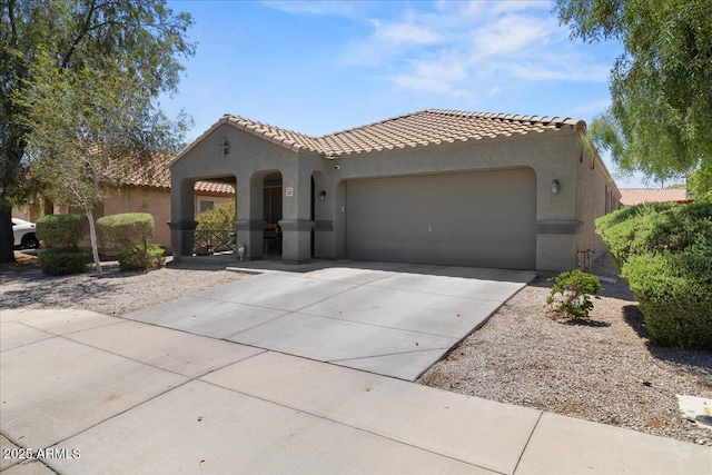 5026 S 235th Dr, Buckeye, AZ 85326 - mediterranean / spanish-style home featuring stucco siding, an attached garage, a tile roof, and driveway