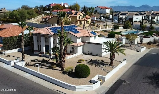 exterior space with a residential view and a mountain view