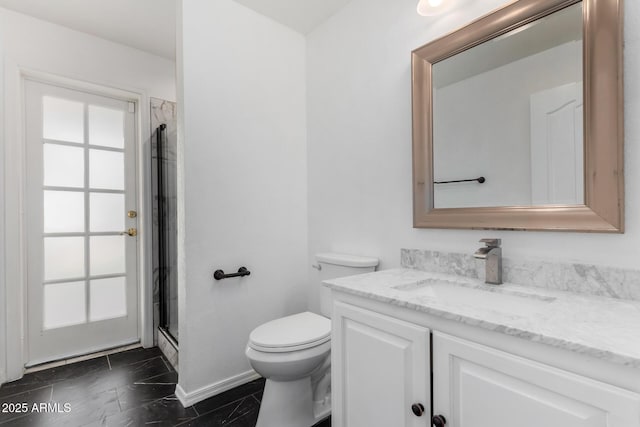 full bath featuring a shower with door, vanity, and toilet