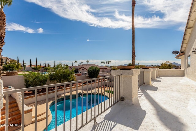 view of swimming pool featuring a fenced backyard and a fenced in pool