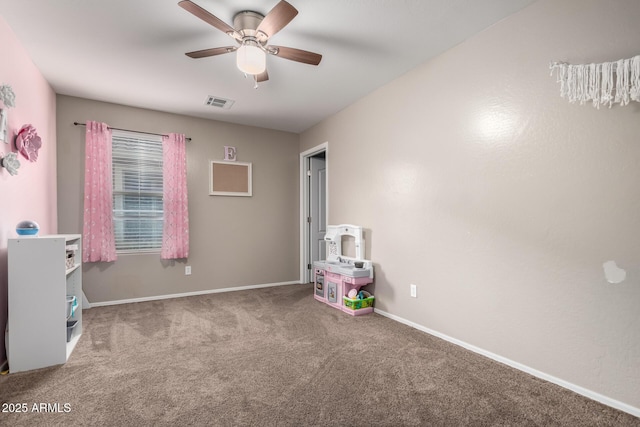 playroom with visible vents, baseboards, ceiling fan, and carpet flooring