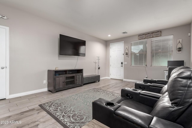 living area featuring recessed lighting, wood finished floors, visible vents, and baseboards