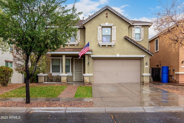 townhome / multi-family property with a porch, a tile roof, concrete driveway, stucco siding, and a garage