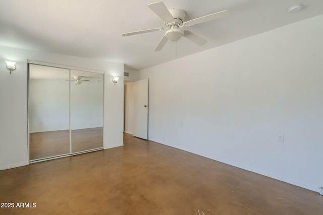 7737 W Medlock Dr, Glendale, AZ 85303 - unfurnished bedroom featuring ceiling fan, a closet, and finished concrete floors