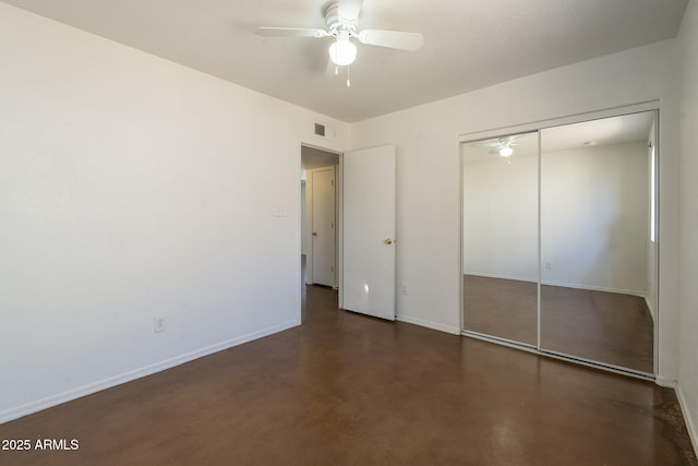 7737 W Medlock Dr, Glendale, AZ 85303 - unfurnished bedroom with a closet, baseboards, visible vents, and concrete flooring