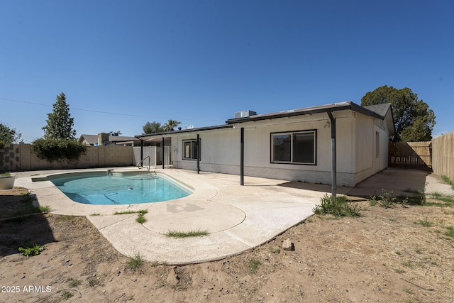 7737 W Medlock Dr, Glendale, AZ 85303 - rear view of property with a fenced in pool, a fenced backyard, and a patio area