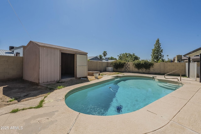 7737 W Medlock Dr, Glendale, AZ 85303 - view of swimming pool with an outbuilding, a patio, a fenced in pool, a shed, and a fenced backyard