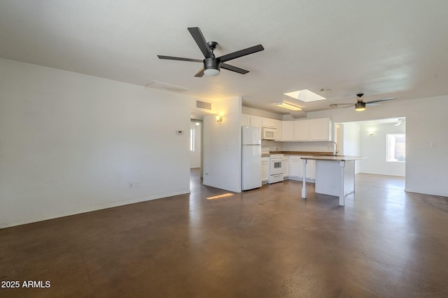 7737 W Medlock Dr, Glendale, AZ 85303 - unfurnished living room with visible vents, baseboards, ceiling fan, finished concrete floors, and a sink