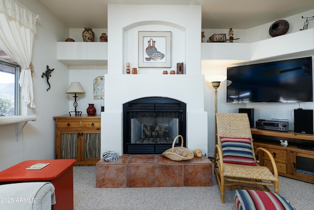 living area featuring a fireplace