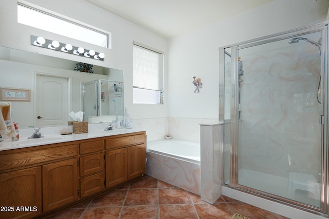 full bathroom featuring a sink, a shower stall, a bath, tile patterned floors, and double vanity